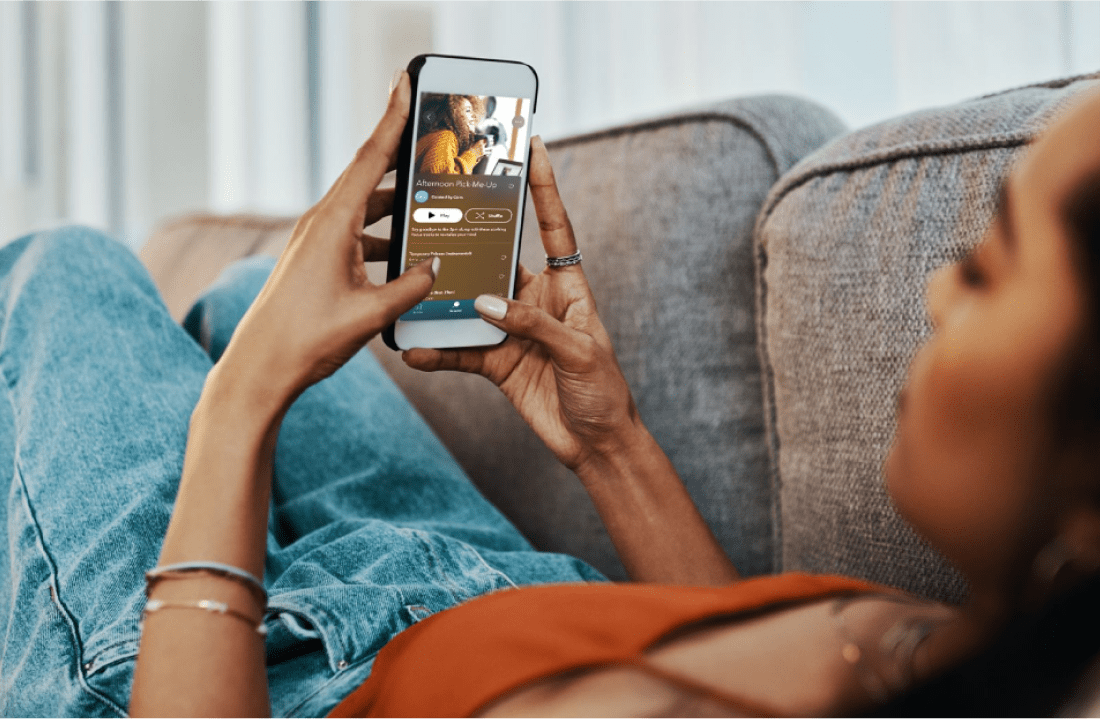 Women relaxing on the couch listening to Calm